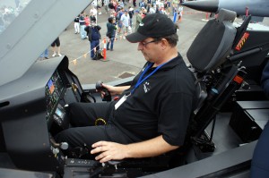 Grant gets to check out the F-35 cockpit. Fortunately it has burners, just like his hot air balloon :)