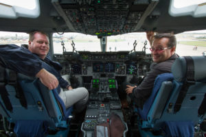 Steve and Grant in the cockpit of a C-17